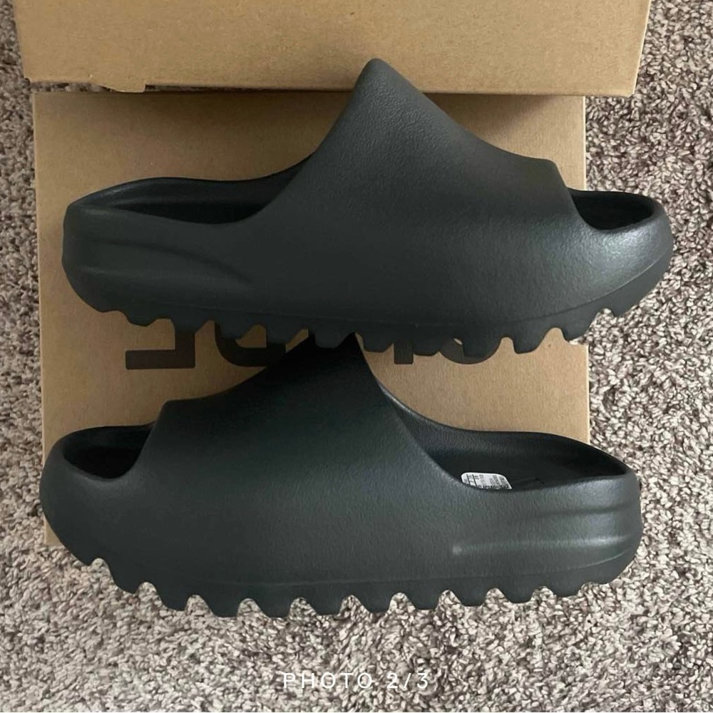 Yeezy Slides. Never worn. They live in the box they came in. Brand new. Black